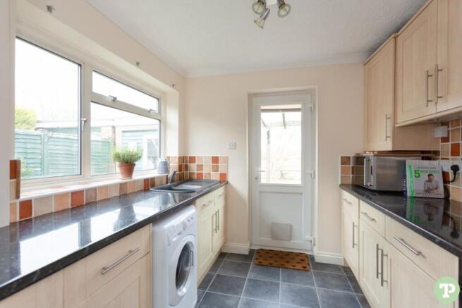 Kitchen with access into rear garden