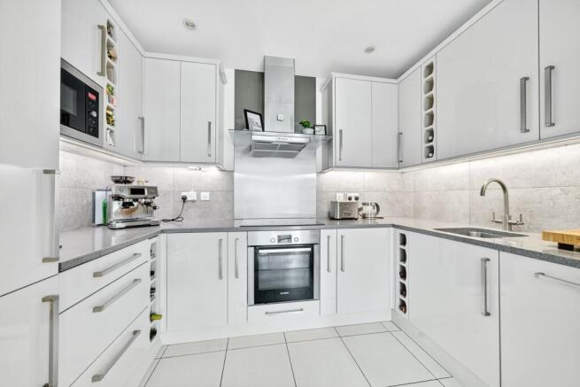 Modern kitchen with integrated appliances, designed for both style and functionality.