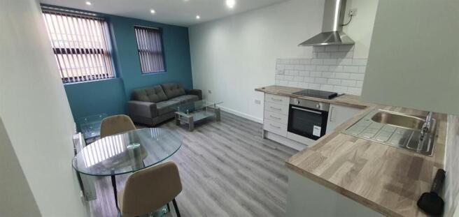 Bright open-plan living area with a modern kitc...