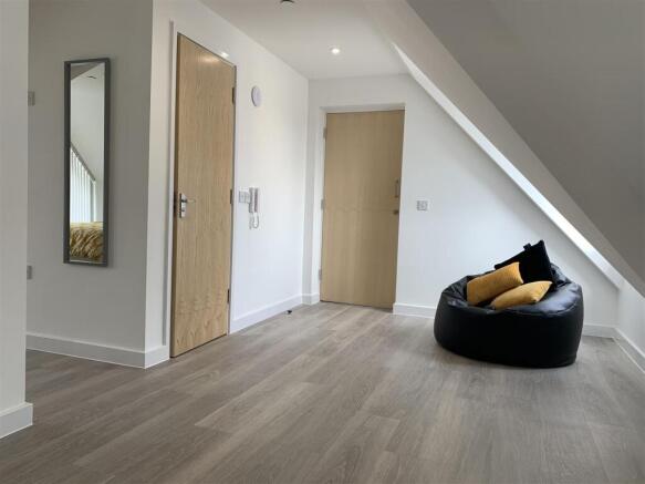 Bright modern landing with stylish beanbag seat...