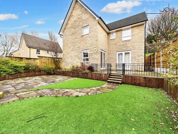 Spacious, Low-Maintenance Garden with Seating Areas and Garage Access