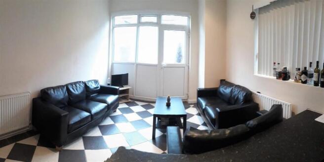 Bright and spacious living area with sofas...