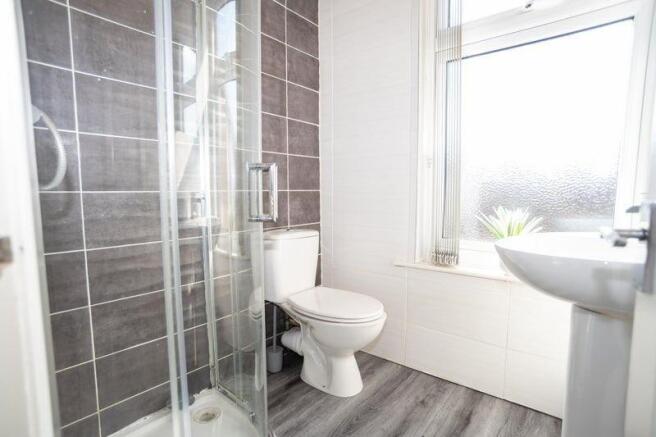 A bright and modern bathroom featuring a compac...