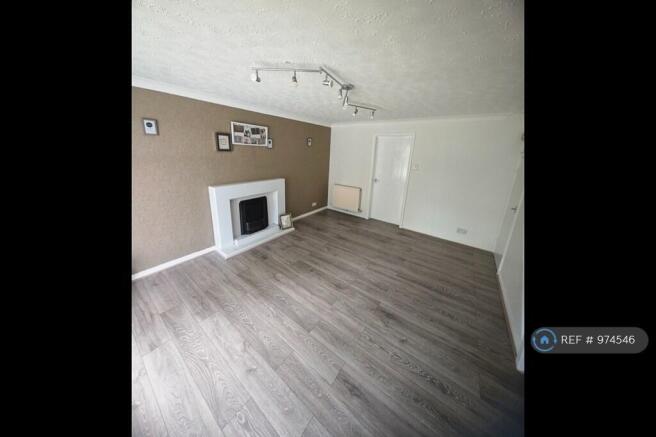 Living Room With Fireplace & Laminate Floor