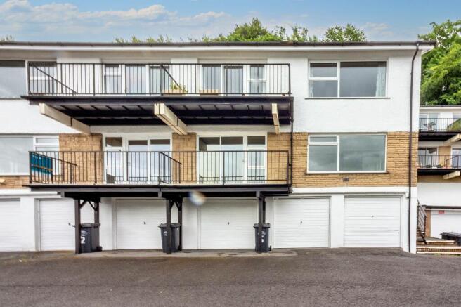 Front exterior, garage & parking space