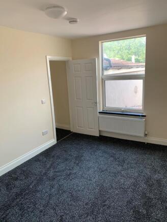 Bright, airy room with plush new dark carpets...