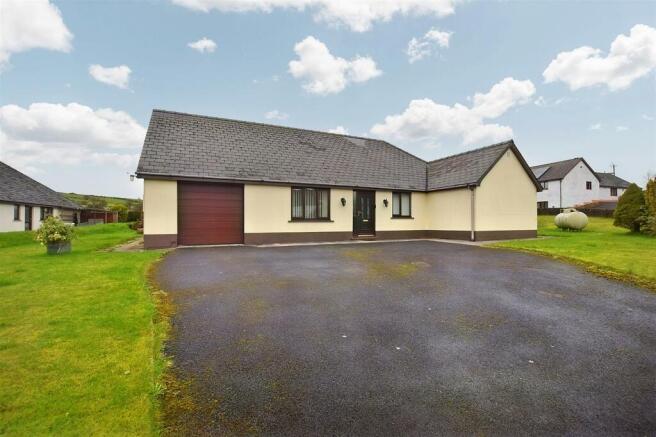 Front of Property + Parking Area