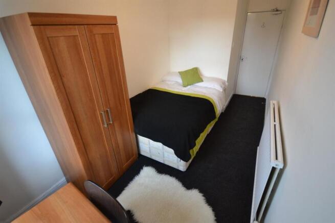 Cozy double bedroom with ample storage space...