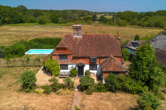 Front elevation, swimming pool and grounds