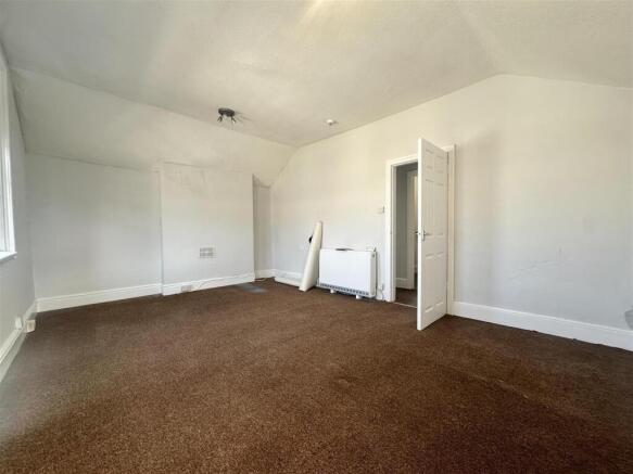 Spacious bright bedroom with high ceilings...