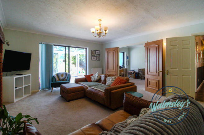Sitting towards dining conservatory & hallway