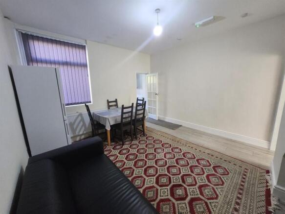 Bright furnished living room with seating, dini...