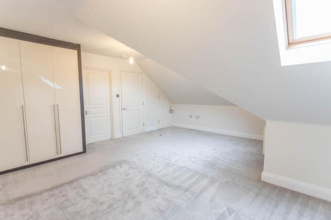 Bedroom 2 with wardrobes