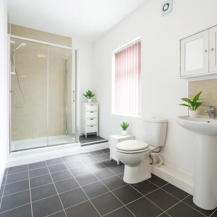 Bright and modern bathroom with walk-in shower...