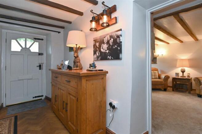 Front door and lounge from stairs.jpg