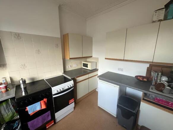 A tidy and functional kitchenette with modern a...