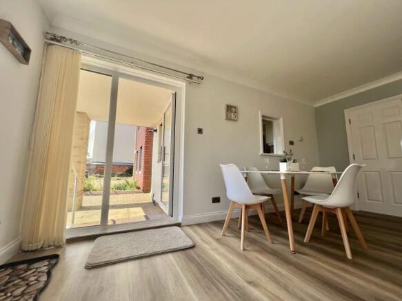 Private entrance with patio area