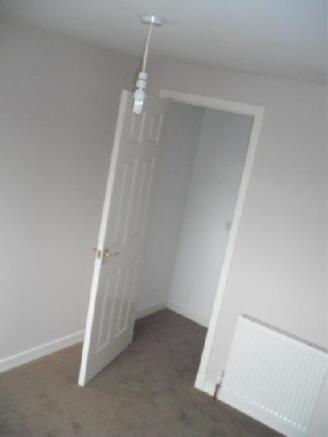 bed 1 showing walk in cupboard