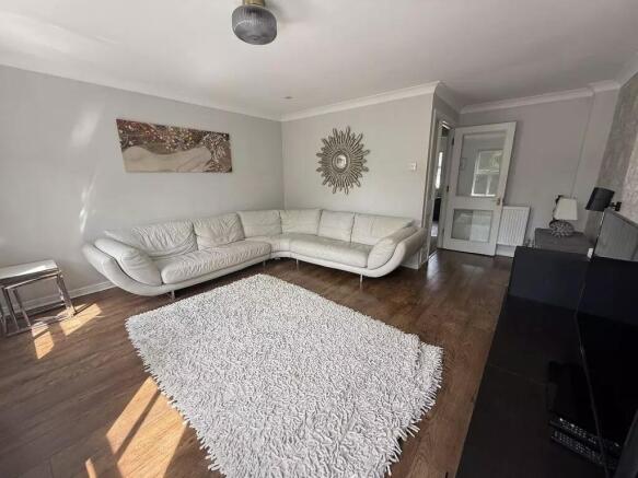 Spacious modern living room with large corner s...