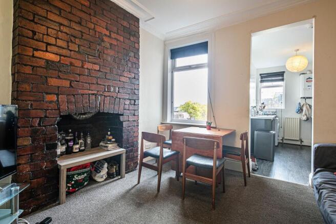 Bright, characterful living room with an expose...