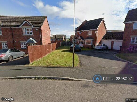 End-Of-Terrace Red Brick Home With Red Front Door.