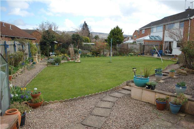 across the rear garden