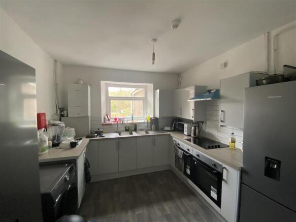 Modern kitchen with sleek units and appliances...