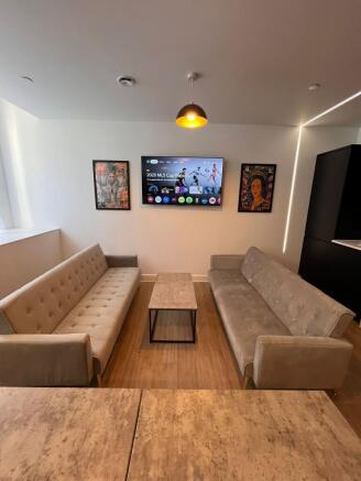 Contemporary living area with two matching grey...