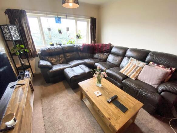 rear first floor bedroom used as lounge.jpg