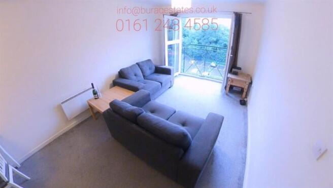 Bright, well-kept living room with two comforta...