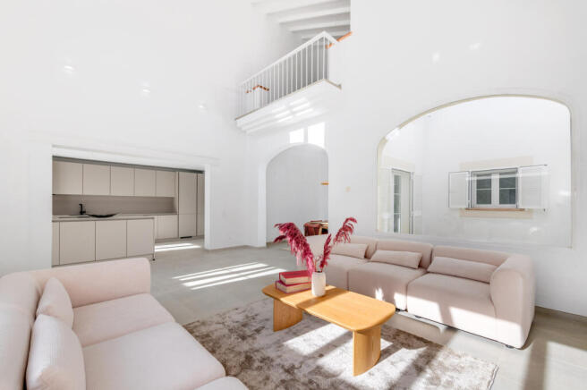 Living area with high ceilings and gallery