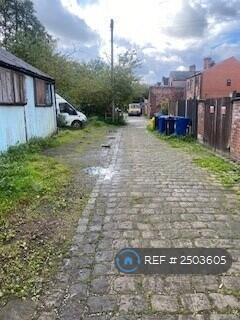 Back Alleyway With Parking Space For One Car