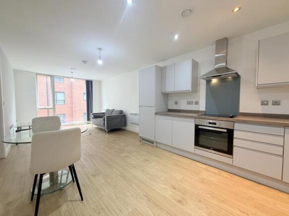 Spacious open-plan living room and fitted kitchen