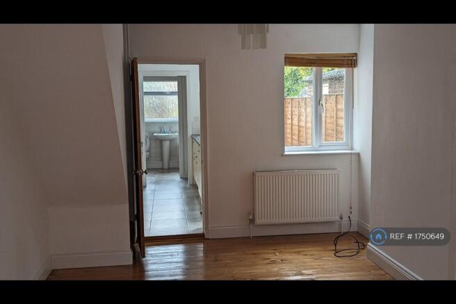 Lounge Through To Kitchen And Downstairs Bathroom.