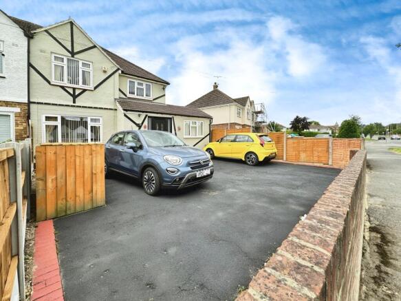 Outside View Of The Property With Driveway Parking