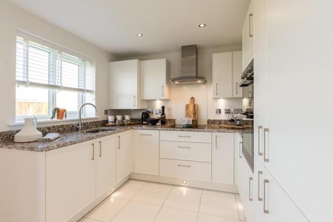 The modern kitchen benefits from ample storage