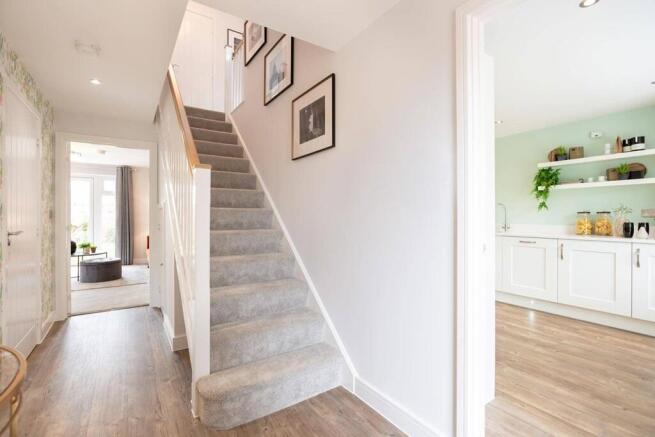 The welcoming entrance hallway offers plenty of natural light