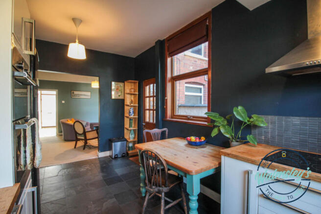 Kitchen through to sitting room
