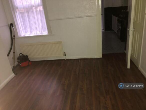 Front Room Leading To The Kitchen Room