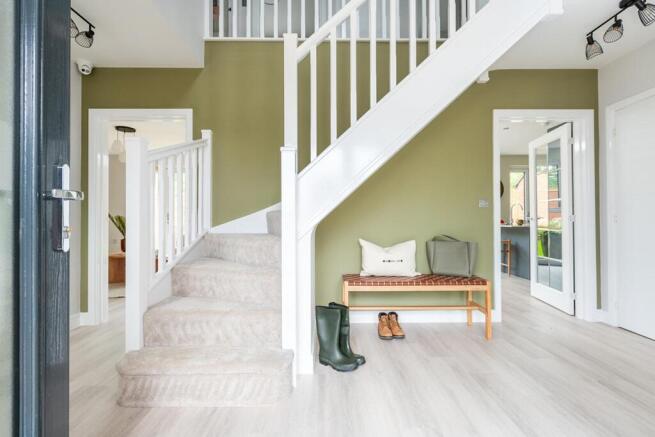 The large hallway is welcoming and provides plenty of space for storage