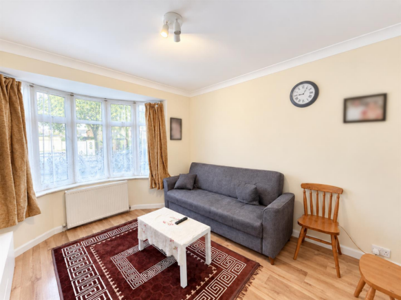 Bright Cozy Living Room with Blurred Wall Art.png