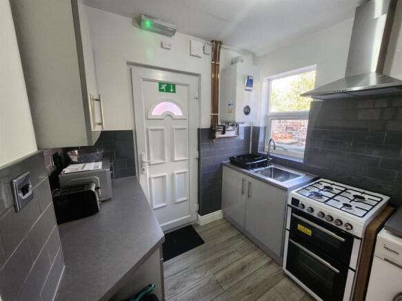 Bright modern kitchen with a gas cooker, extrac...