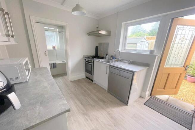 Kitchen leads out to