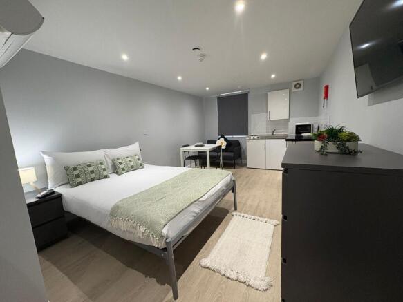 Bright, modern studio with a comfortable double...