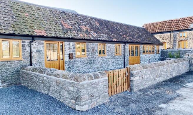 Charming stone-front cottage with timber-framed...