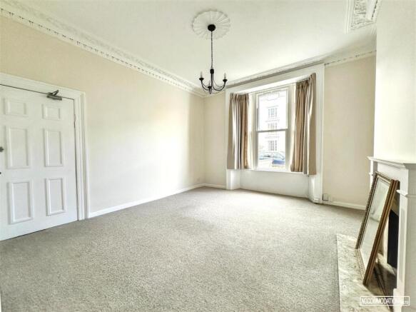 Bright, spacious bedroom with large sash window...