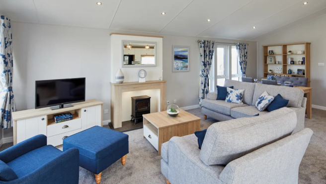Stylish Lounge With Grey Sofas, Blue Accents And F