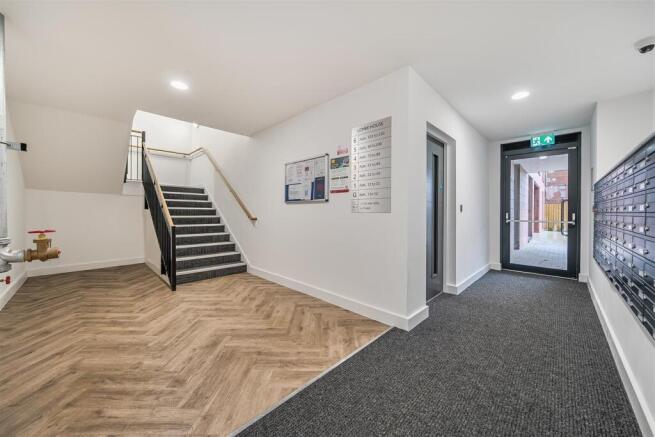 Modern entrance hall with stylish flooring...