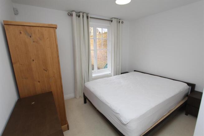 Bright double bedroom with ample storage...