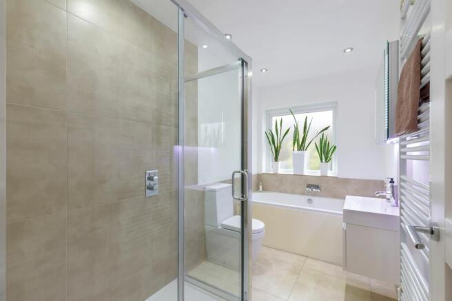 family bathroom with shower and separate bath